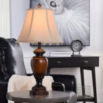Sienna Table Lamp With Its Antiqued Warm Wood Finish And Coordinating Cream Bell Shade - Image 3