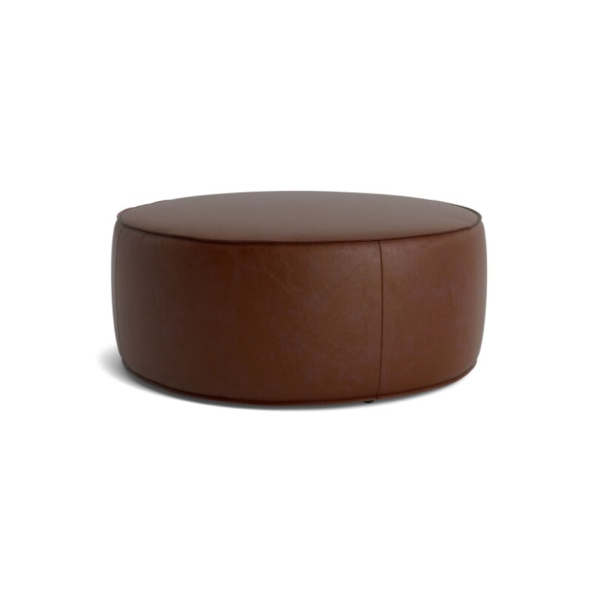 fd74b4073f4695a128455c74465b0ce8 Rhonda Round Leather Ottoman - Image 1
