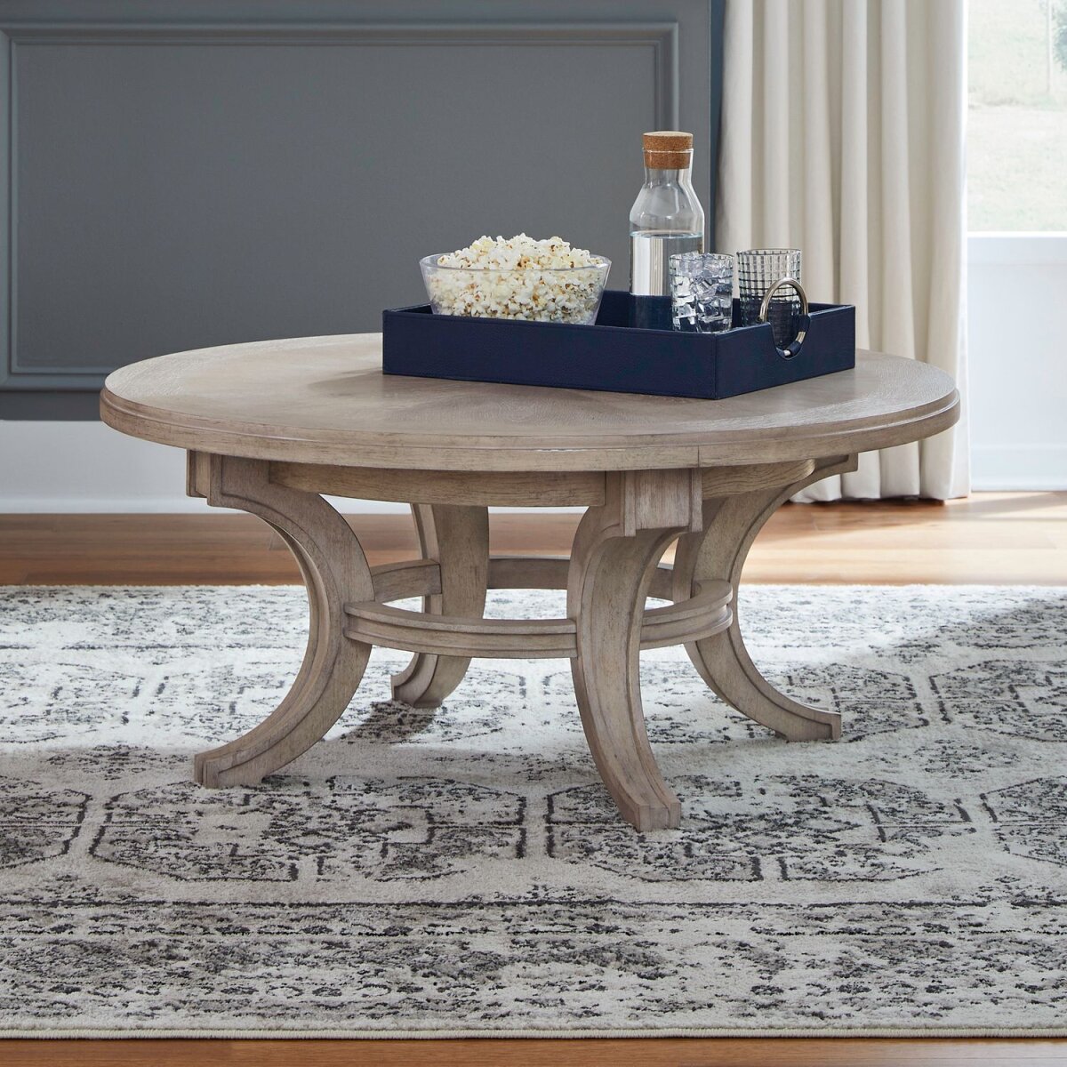 7c7d5d2d1879d6ffe97b8a532d003f2b Round Cocktail Table - Image 1